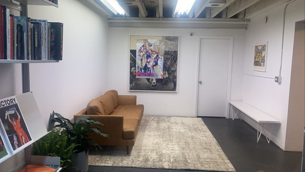 Lounge area with sofa and artwork